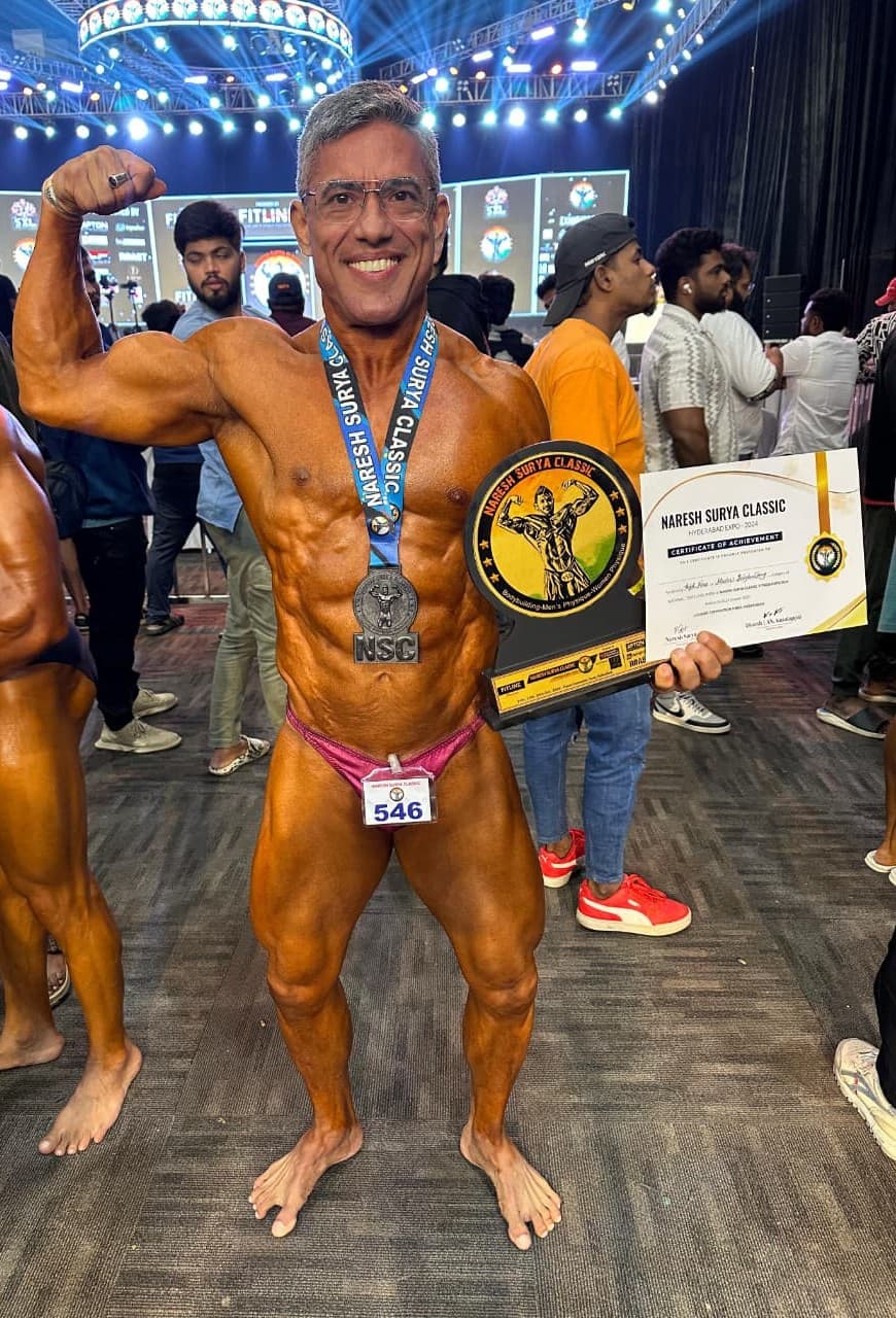 Jehangir after competition — medal, trophy and certificate
